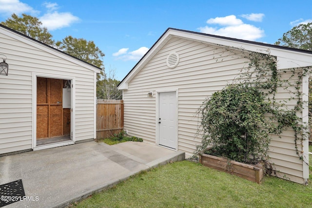 view of outbuilding featuring a lawn