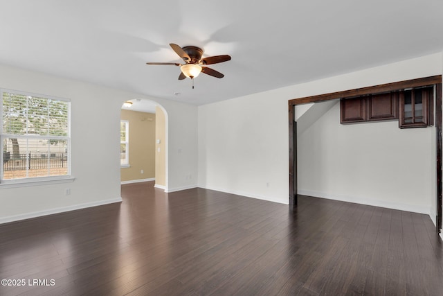 unfurnished room featuring dark hardwood / wood-style floors and ceiling fan