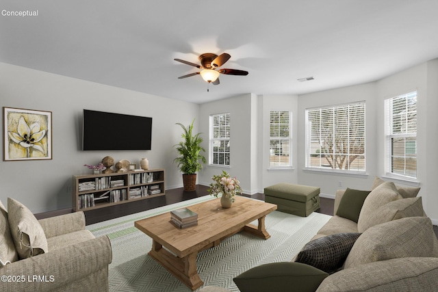 living room with hardwood / wood-style floors and ceiling fan