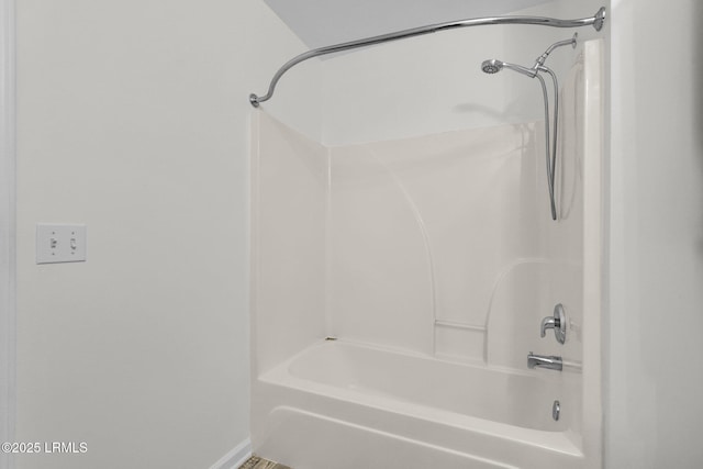 bathroom with shower / washtub combination