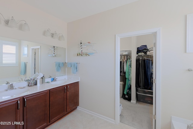 bathroom featuring vanity and a washtub