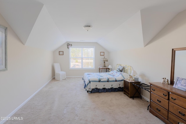 unfurnished bedroom featuring light carpet and lofted ceiling