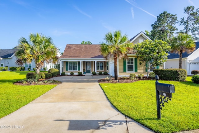 18 Yonges Island Dr, Bluffton, SC 29910 - view of front of home featuring concrete driveway, a front yard, and covered porch