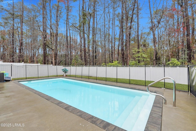 view of pool with a fenced in pool, a fenced backyard, and a patio area