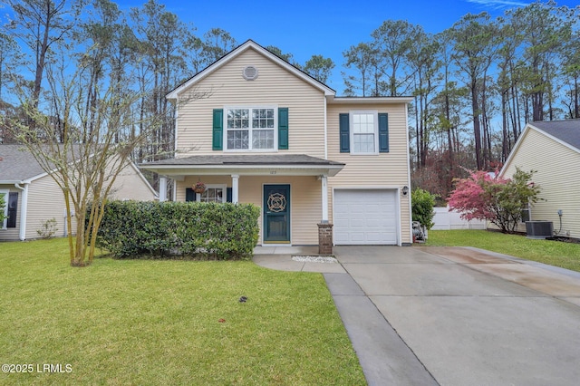 traditional home with central AC unit, an attached garage, covered porch, a front lawn, and concrete driveway