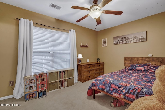 carpeted bedroom featuring visible vents and ceiling fan