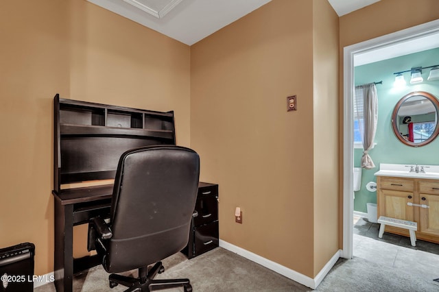 carpeted office with baseboards