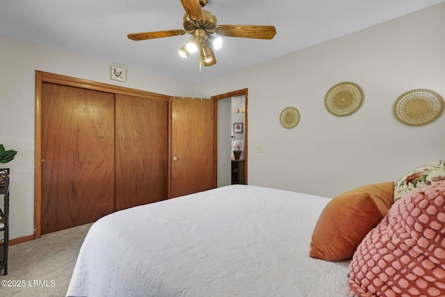 bedroom with baseboards, a closet, carpet floors, and ceiling fan