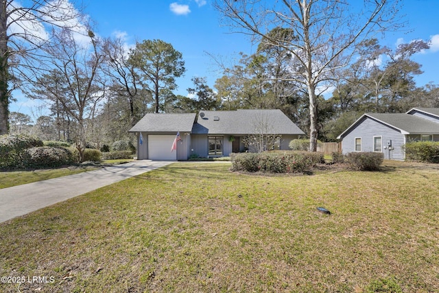 single story home with concrete driveway, an attached garage, and a front lawn