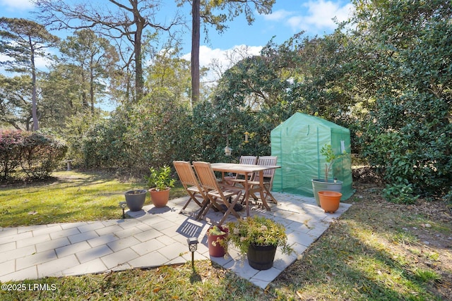 view of patio / terrace with an outbuilding