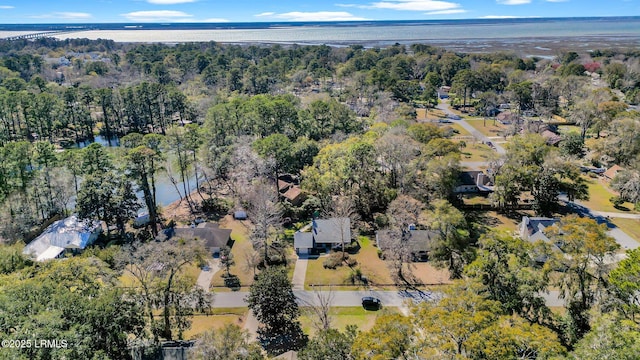 birds eye view of property featuring a wooded view