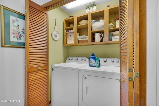 laundry area featuring separate washer and dryer and laundry area