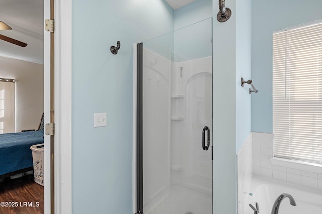 ensuite bathroom featuring ensuite bath, a bath, and a shower stall