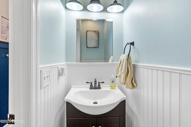 bathroom with wainscoting and vanity