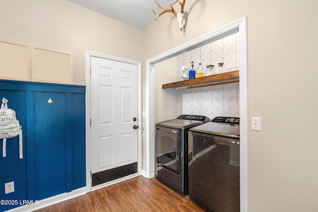 clothes washing area with laundry area, dark wood-style flooring, and independent washer and dryer