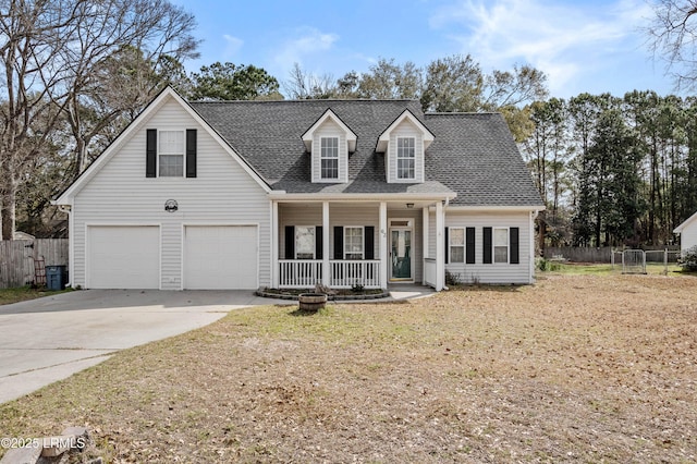 cape cod home with a porch, a garage, a shingled roof, fence, and concrete driveway