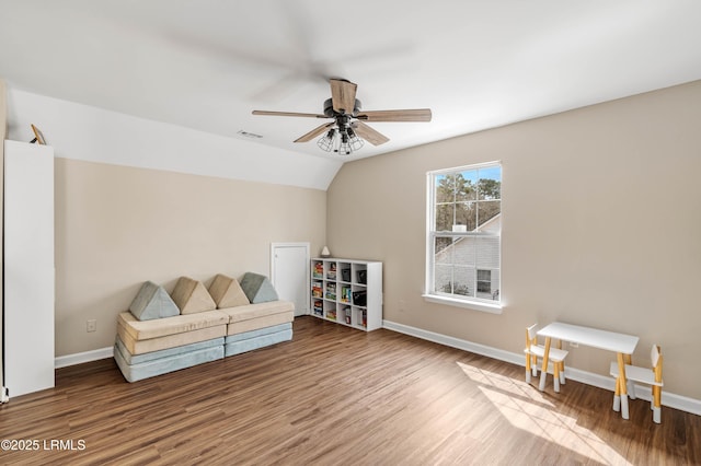 living area featuring ceiling fan, wood finished floors, and baseboards