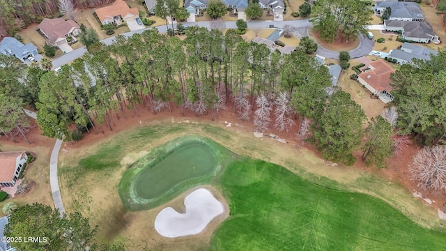 birds eye view of property featuring view of golf course and a residential view