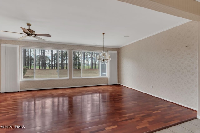 unfurnished dining area with crown molding, wood finished floors, a wealth of natural light, and wallpapered walls