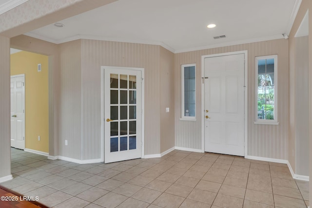 entrance foyer with light tile patterned flooring, crown molding, visible vents, baseboards, and wallpapered walls