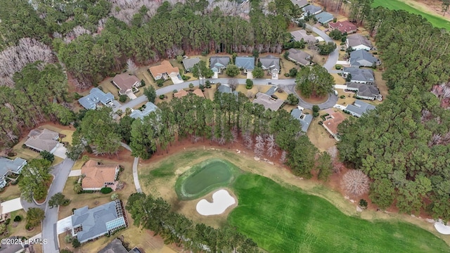 aerial view with golf course view and a residential view