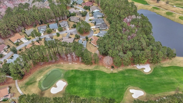 drone / aerial view with a water view, a residential view, and golf course view