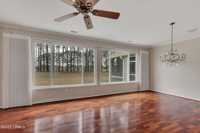 interior space with wood finished floors, visible vents, crown molding, and wallpapered walls