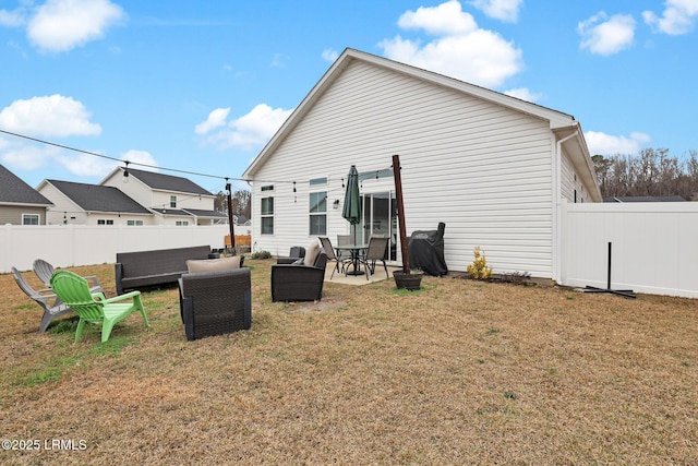 back of property with a patio area, an outdoor hangout area, and a lawn