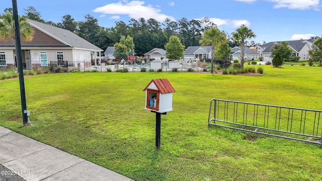 view of community with a yard