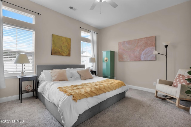 bedroom featuring light colored carpet and ceiling fan