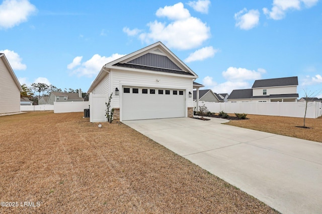 view of front of property with a garage and a front yard