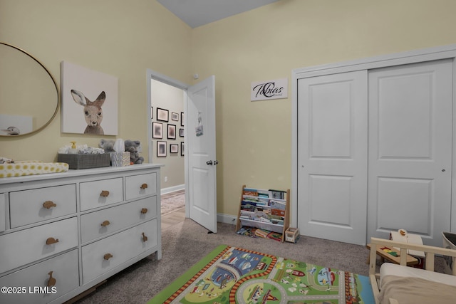 carpeted bedroom with a closet