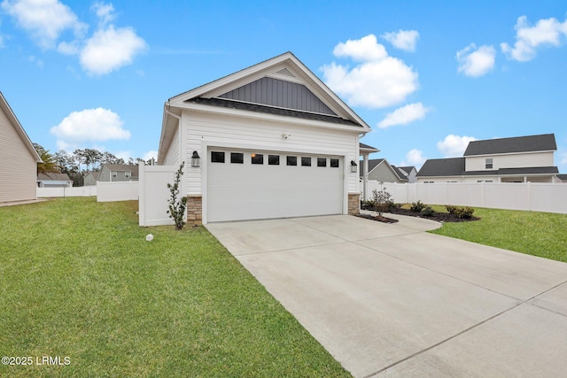 1836 Hearthstone Dr, Ridgeland, SC 29936 - view of front of house with board and batten siding, stone siding, a garage, and driveway