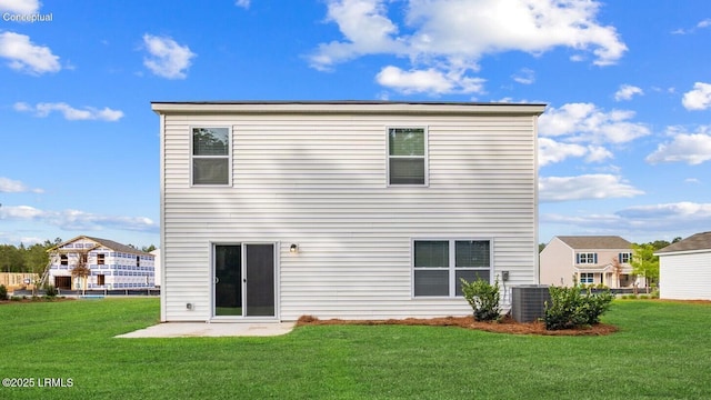 1595 Sanctum St, Ridgeland, SC 29936 - rear view of house featuring central AC unit, a lawn, and a patio area