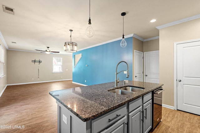 4944 Tidal Walk Ln, Beaufort, SC 29907 - kitchen with ceiling fan, light wood-style flooring, gray cabinetry, ornamental molding, and hanging light fixtures