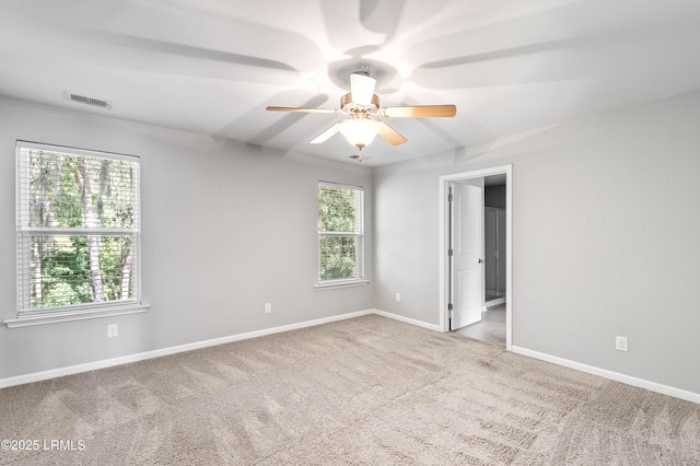 4944 Tidal Walk Ln, Beaufort, SC 29907 - carpeted empty room featuring a ceiling fan and healthy amount of natural light