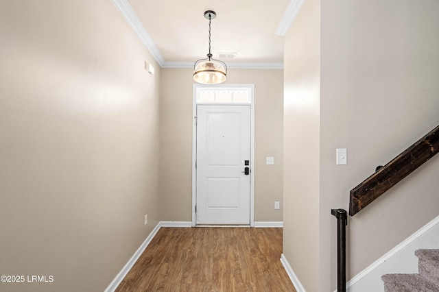 4944 Tidal Walk Ln, Beaufort, SC 29907 - entryway featuring light wood-style flooring, crown molding, stairway, and a chandelier
