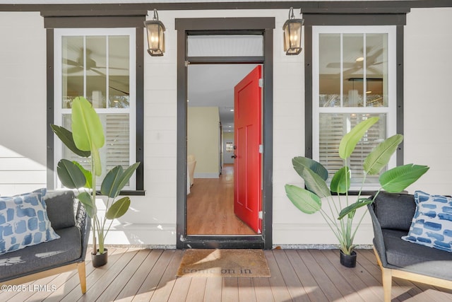 entrance to property with covered porch and concrete block siding