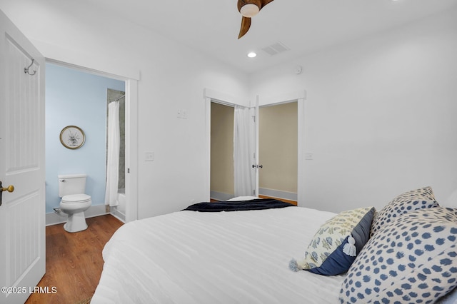 bedroom with visible vents, ceiling fan, wood finished floors, ensuite bathroom, and recessed lighting