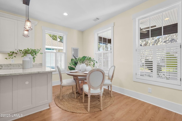 dining area with light wood-type flooring, visible vents, baseboards, and recessed lighting