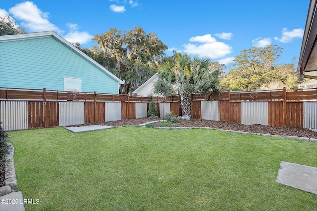 view of yard with a fenced backyard