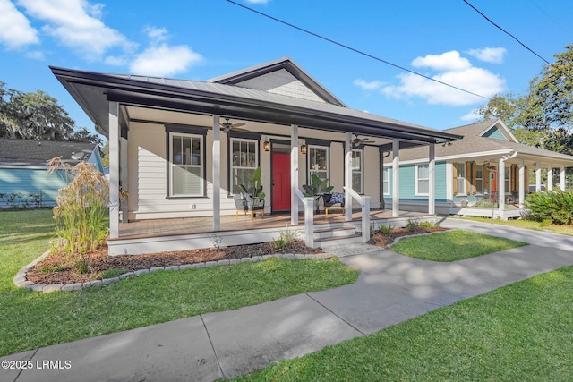 view of front of home featuring covered porch and a front lawn