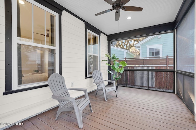 sunroom / solarium with ceiling fan