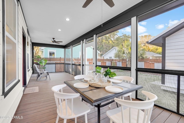 sunroom with a ceiling fan