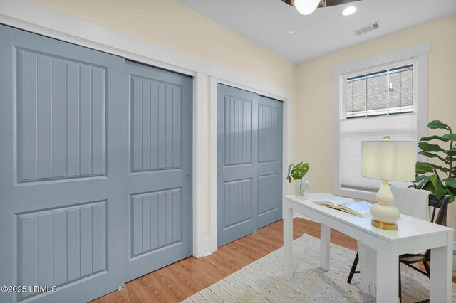 home office with visible vents and light wood finished floors