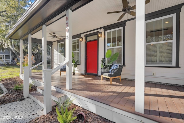 wooden terrace featuring a ceiling fan and covered porch