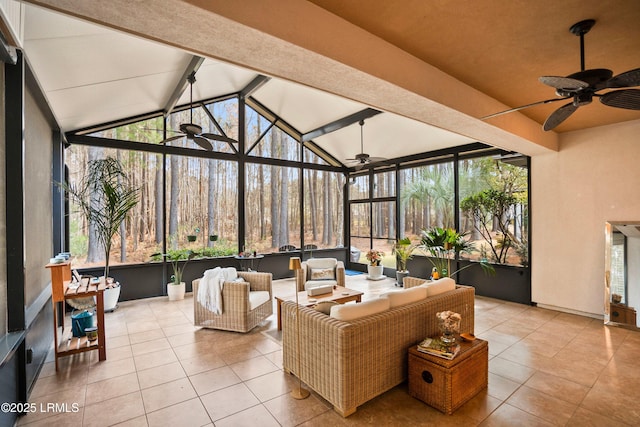 sunroom / solarium with ceiling fan and vaulted ceiling with beams