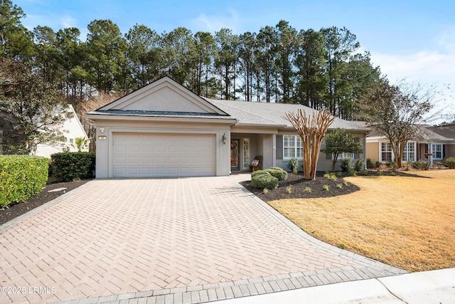 ranch-style home featuring a garage