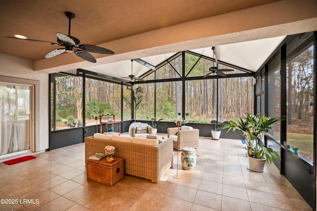 sunroom / solarium with a healthy amount of sunlight, ceiling fan, and lofted ceiling