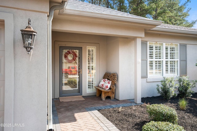 property entrance with a patio area